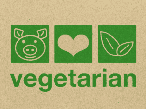 A green cardboard box with the word vegetarian on it.