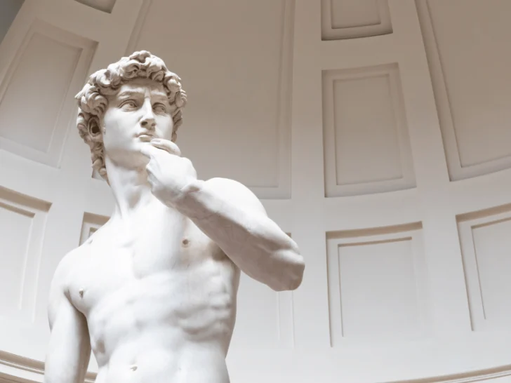 A museum statue depicting Michelangelo's transformative impact on the world.