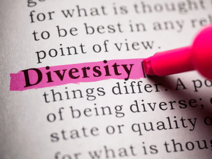 A marker highlights 'diversity' in a book.