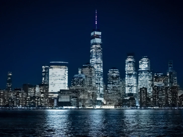 New York City skyline at night, showcasing the big apple's vibrant energy.