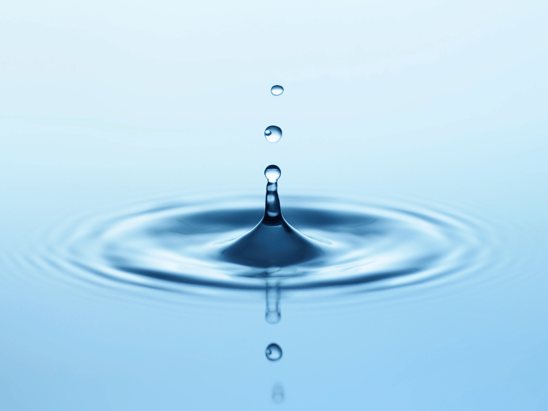 A drop of water on a blue background, symbolizing the essence of a great story